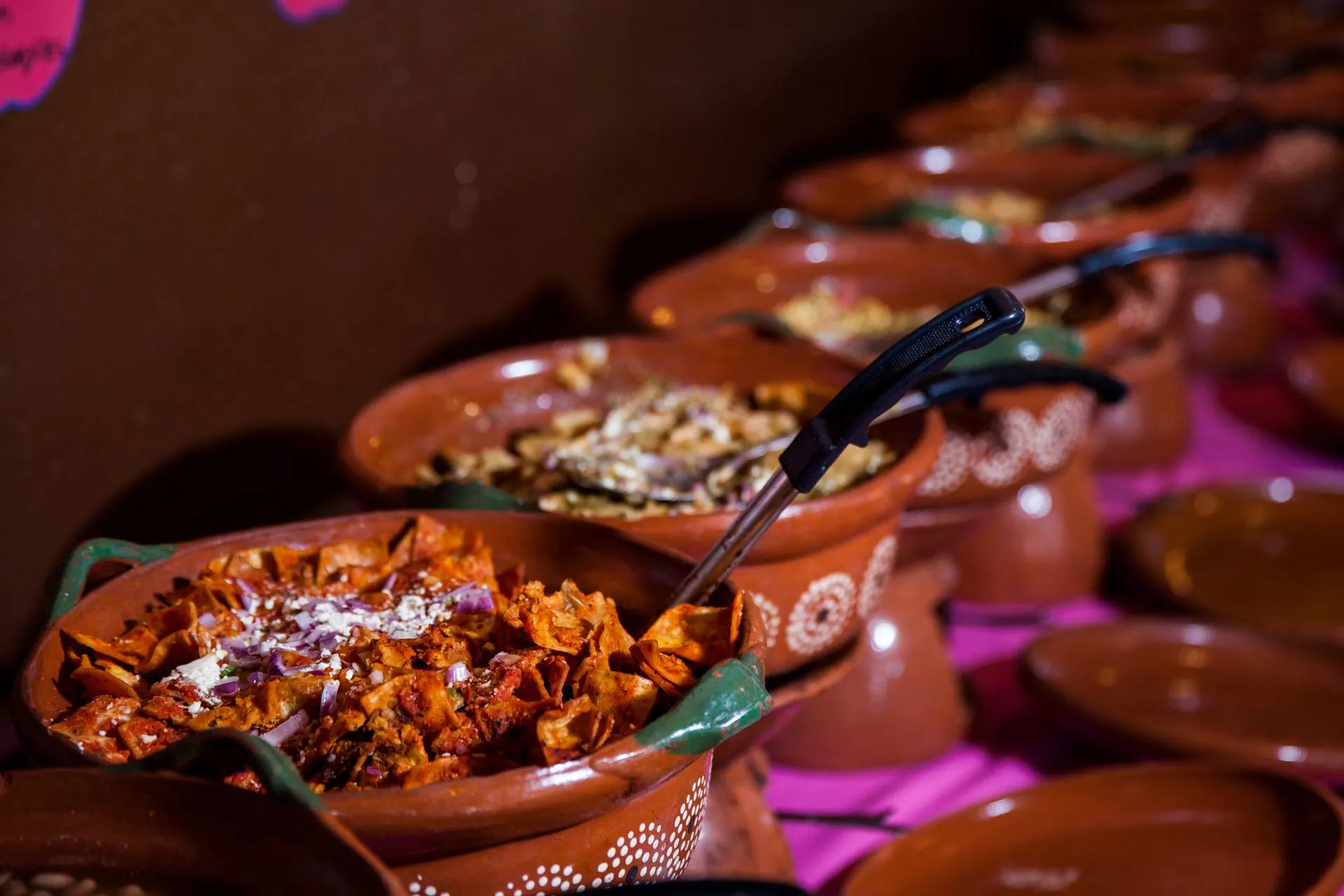 Chilaquiles buffet in clay cazuelas